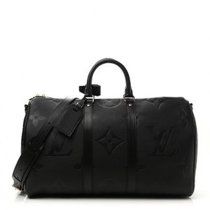 Louis Vuitton black genuine leather duffle bag w/ gold accents